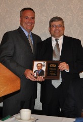 Bob Beretta of Army West Point presents Jones the Pete Nevins Award for Distinguished Achievement (2011) at the ECAC-SIDA workshop.